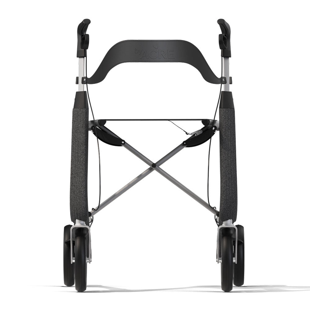 Rear view of a robust black byACRE Nordic Pioneer rollator featuring the contoured backrest attachment for relaxing seated outdoor breaks.